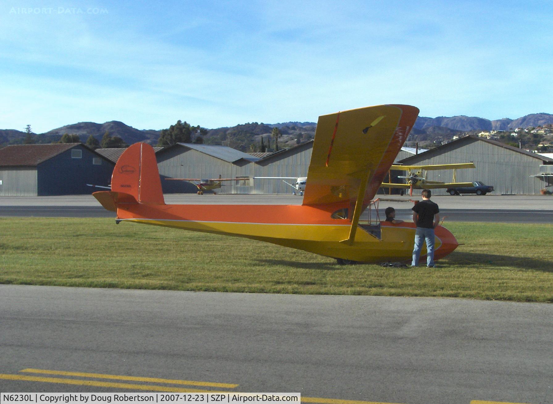 N6230L, 1964 Schweizer SGU 2-22E C/N 182, 1964 Schweizer SGU 2-22E Glider, Son in front seat-Dad in back, awaiting tow on Rwy 04R grass by Mom flying N65124 'Spirit of Opec'