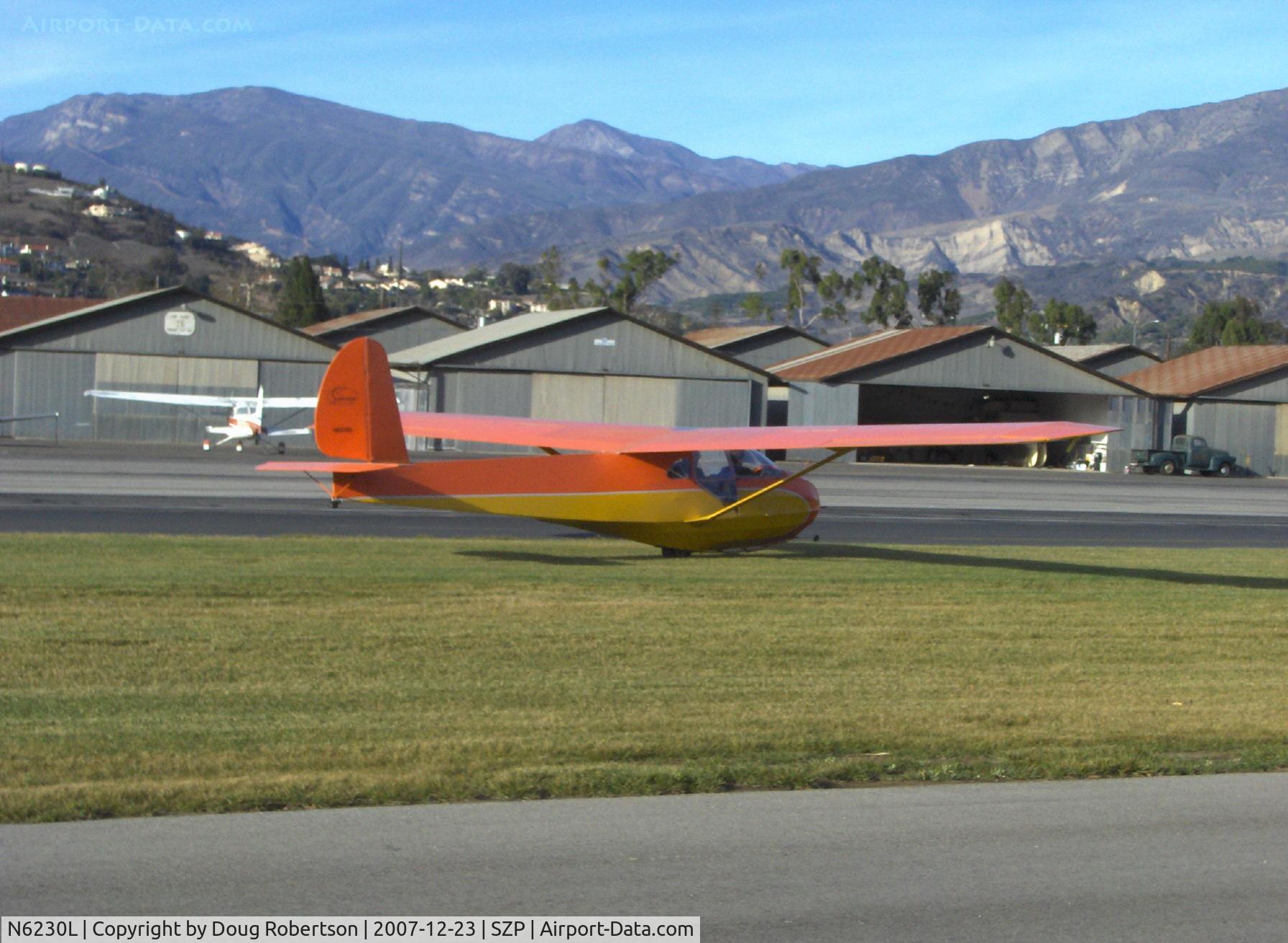 N6230L, 1964 Schweizer SGU 2-22E C/N 182, 1964 Schweizer SGU 2-22E Glider, Son in front seat-Dad in back, under tow on Rwy 04R grass by Mom flying N65124 'Spirit of Opec'