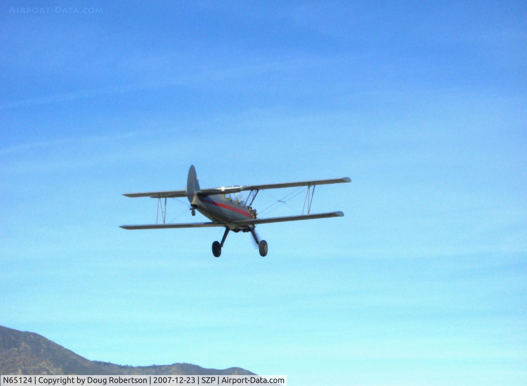N65124, 1943 Boeing A75N1(PT17) C/N 75-1260, 1943 Boeing Stearman A75N1 (PT-17) 'Spirit of OPEC', P&W R-985 450 Hp (by Jacobs), low pass over grass, released glider towline before landing