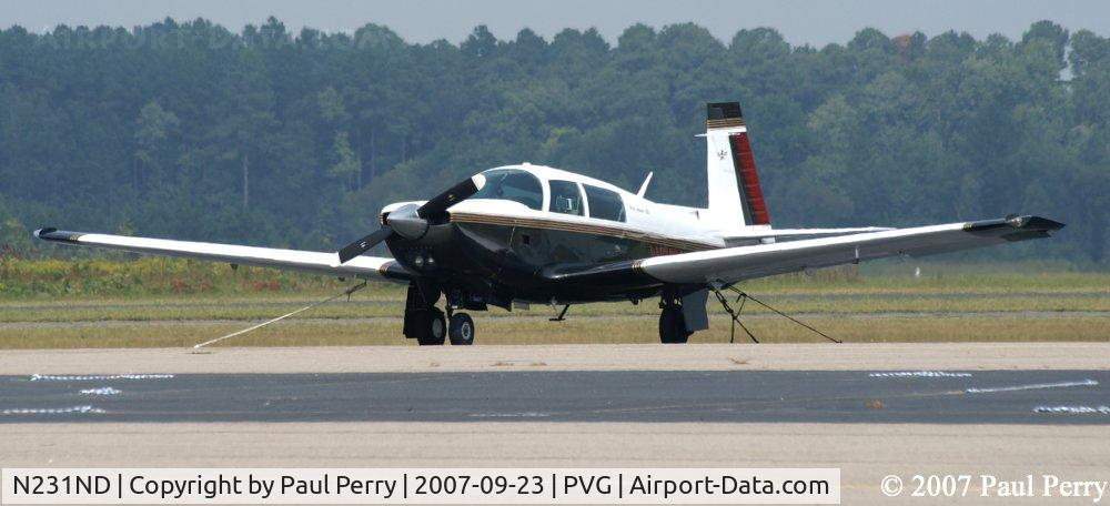 N231ND, 1979 Mooney M20K C/N 25-0207, Sitting on a hill, apparently?