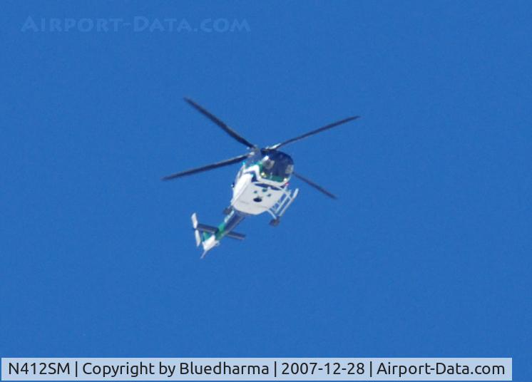N412SM, 1998 Bell 412EP C/N 36213, Heading NE over Columbine High School Littleton, CO