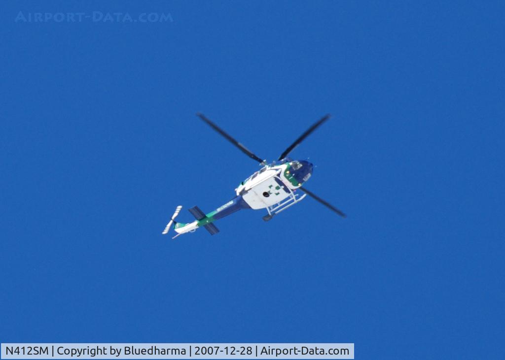 N412SM, 1998 Bell 412EP C/N 36213, Heading NE over Columbine High School Littleton, CO