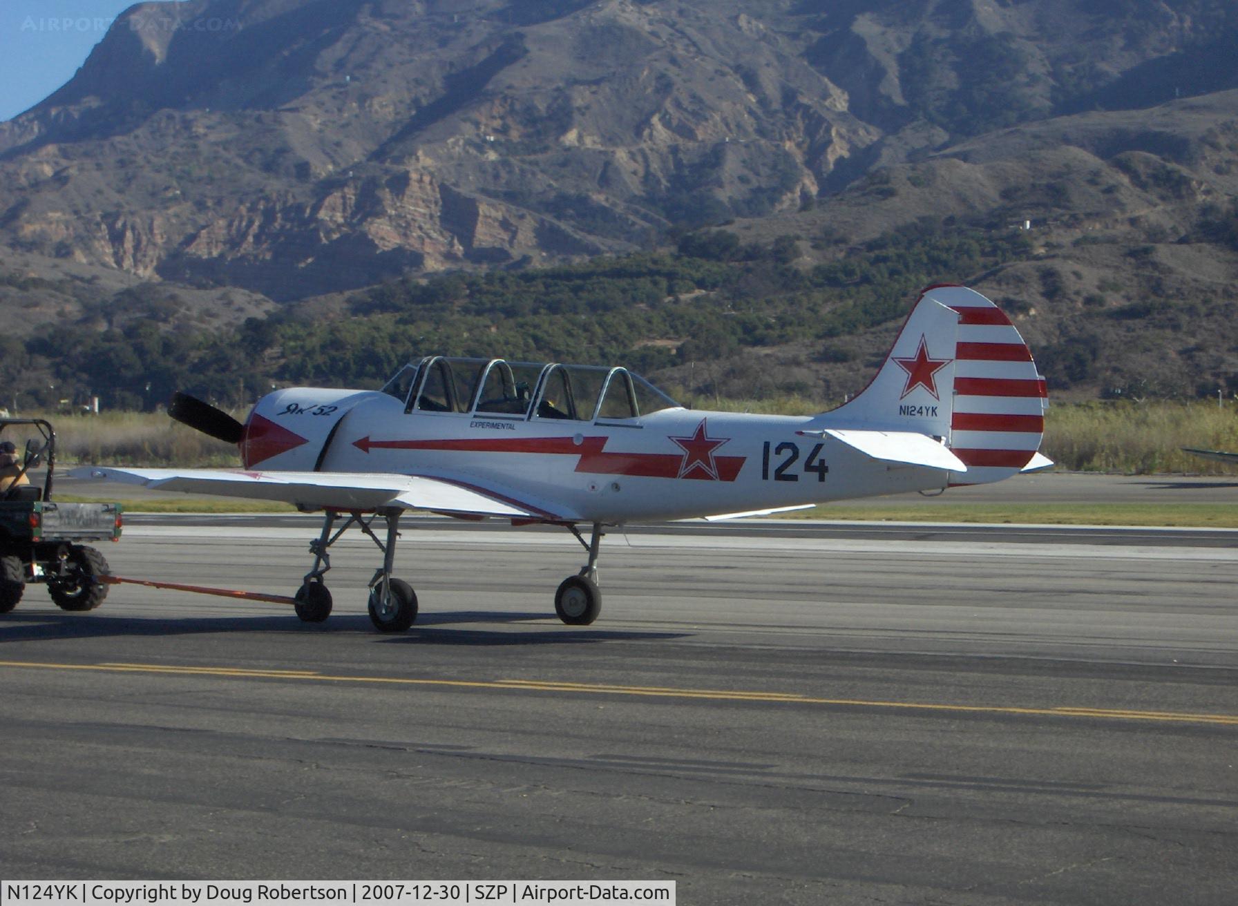 N124YK, 1984 Yakovlev Yak-52 C/N 844804, 1984 Intreprinderea de Avioane-Bacau, Romania (Yakovlev) Yak 52, Vedeneev MP-14P 9 cylinder radial 360 Hp, tow to fuel dock