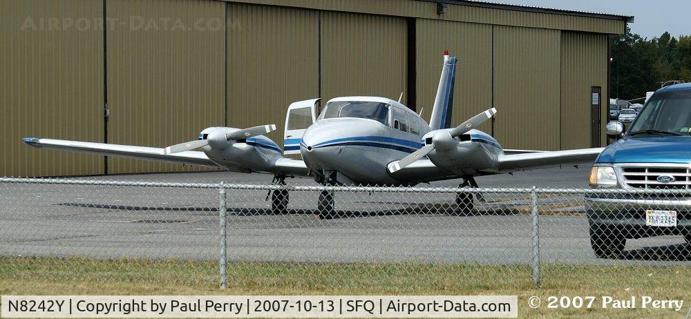 N8242Y, 1966 Piper PA-30 Twin Comanche Twin Comanche C/N 30-1368, In the space between hangars, looks like she has a new home