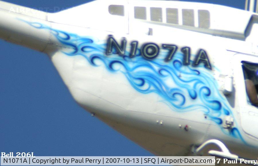 N1071A, 1979 Bell 206L-1 LongRanger II C/N 45340, Close-up of the waves, and airbrushed reg number