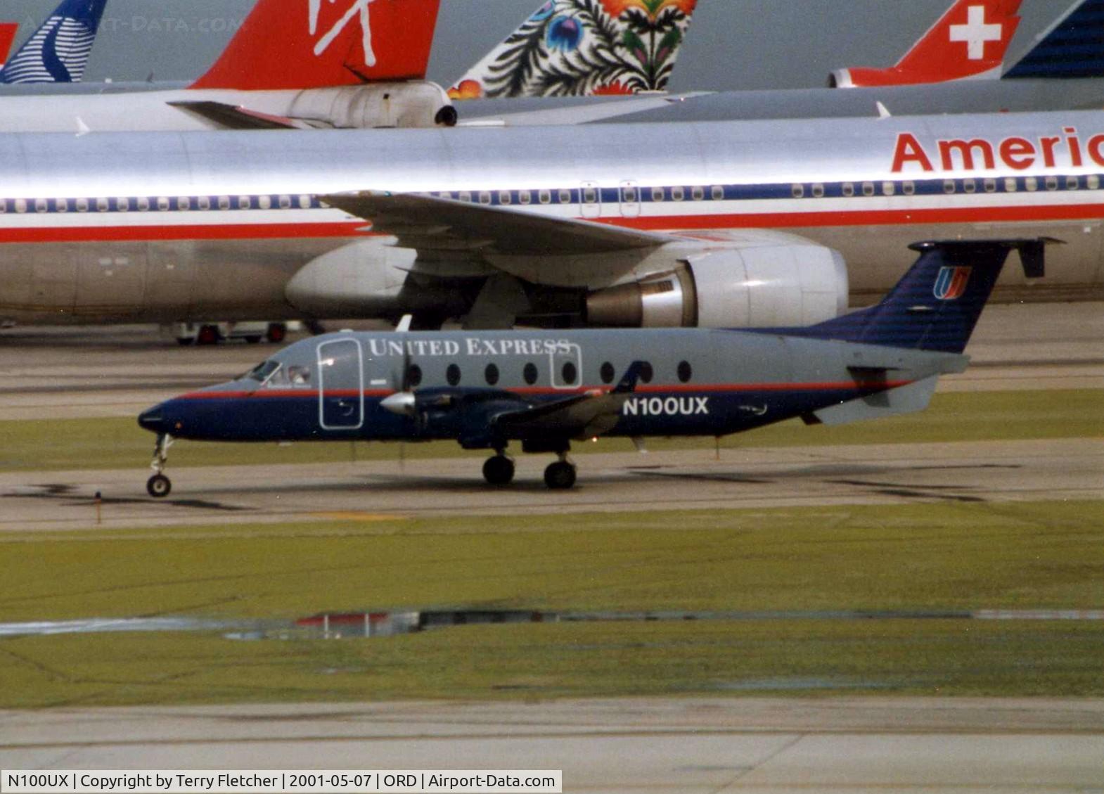 N100UX, 1994 Beech 1900D C/N UE-100, Beech 1900D dwarfed by all the TransAtlantic Carriers at Chicago O'Hare