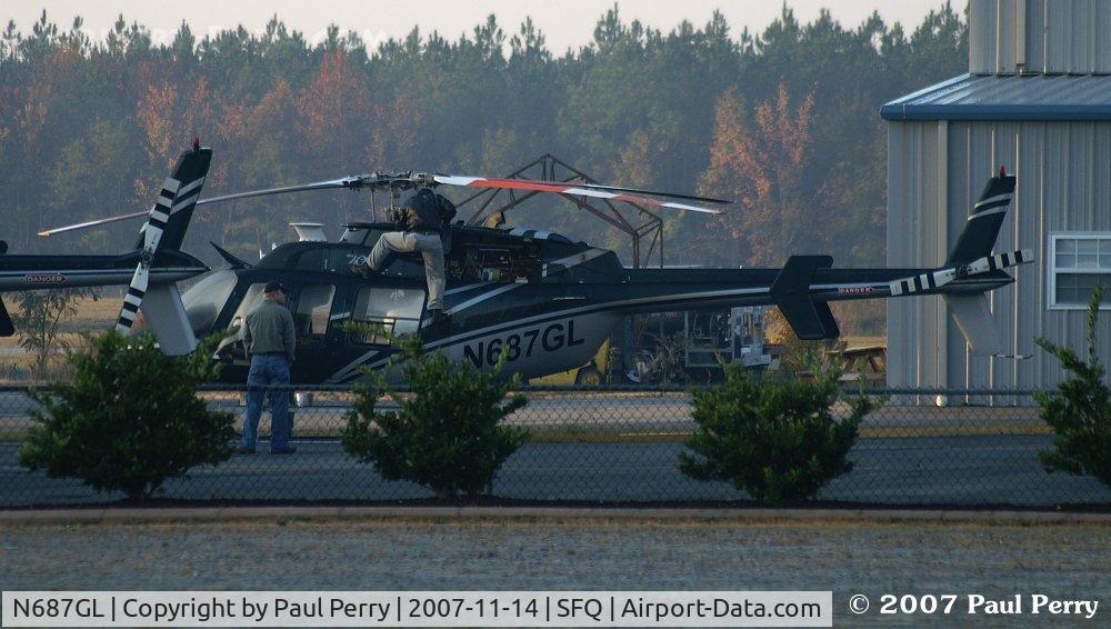 N687GL, 1997 Bell 407 C/N 53147, Having a look under the 