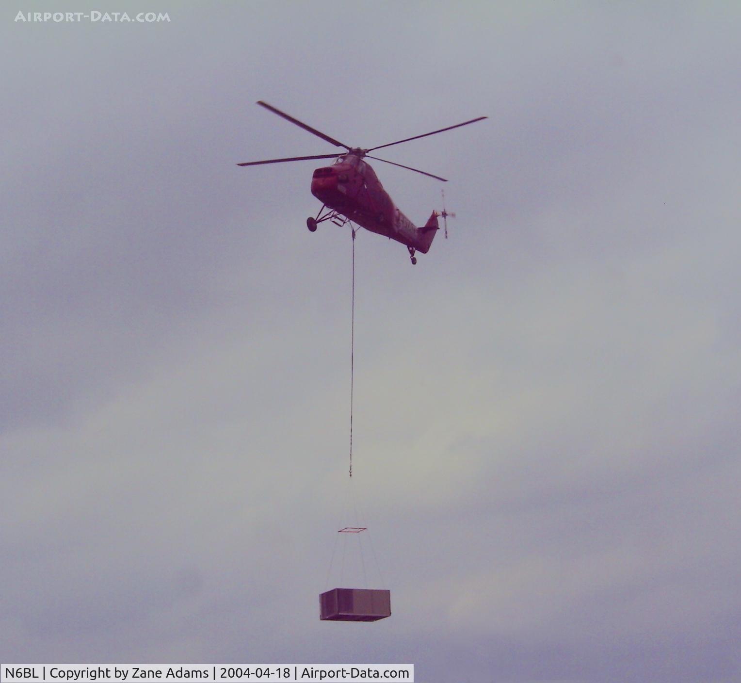N6BL, 1962 Sikorsky S-58ET C/N 58-1567, Working in Arlington, TX lifting HVAC units onto a movie theater @ 2004