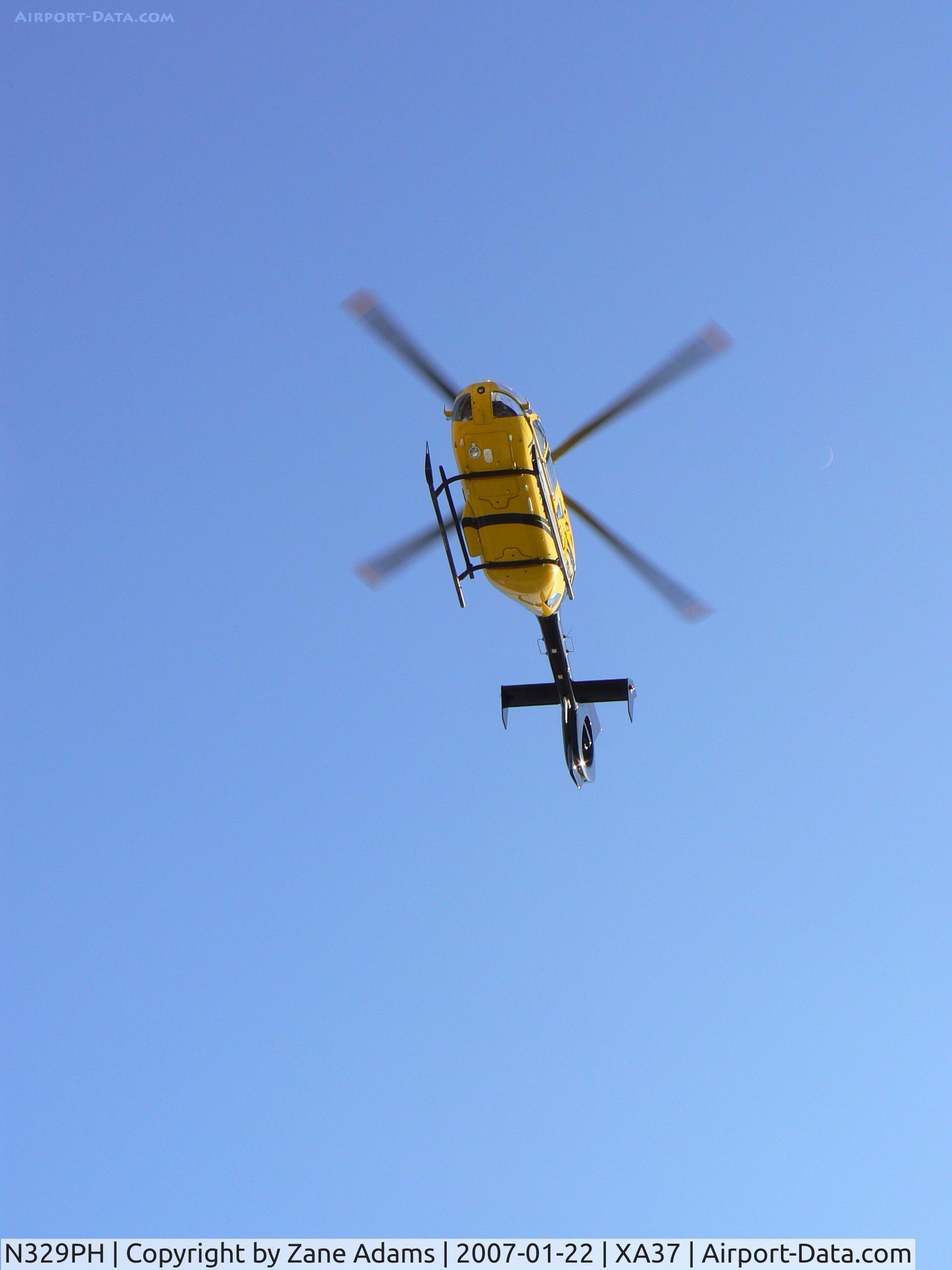 N329PH, 2006 Eurocopter EC-135P-2 C/N 0489, Leaving hospital pad in the medical district @ Ft. Worth, TX