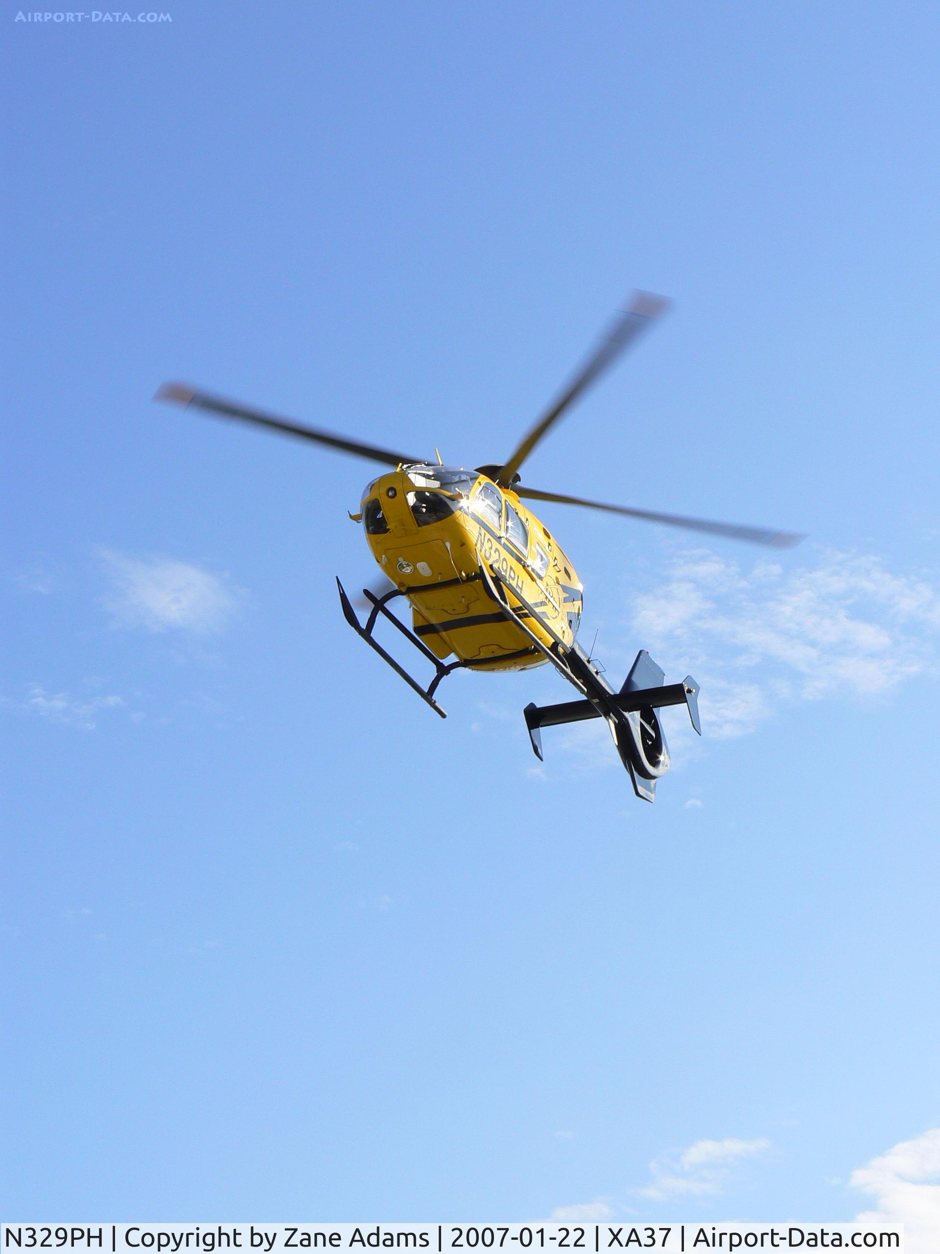 N329PH, 2006 Eurocopter EC-135P-2 C/N 0489, Leaving hospital pad in the medical district @ Ft. Worth, TX