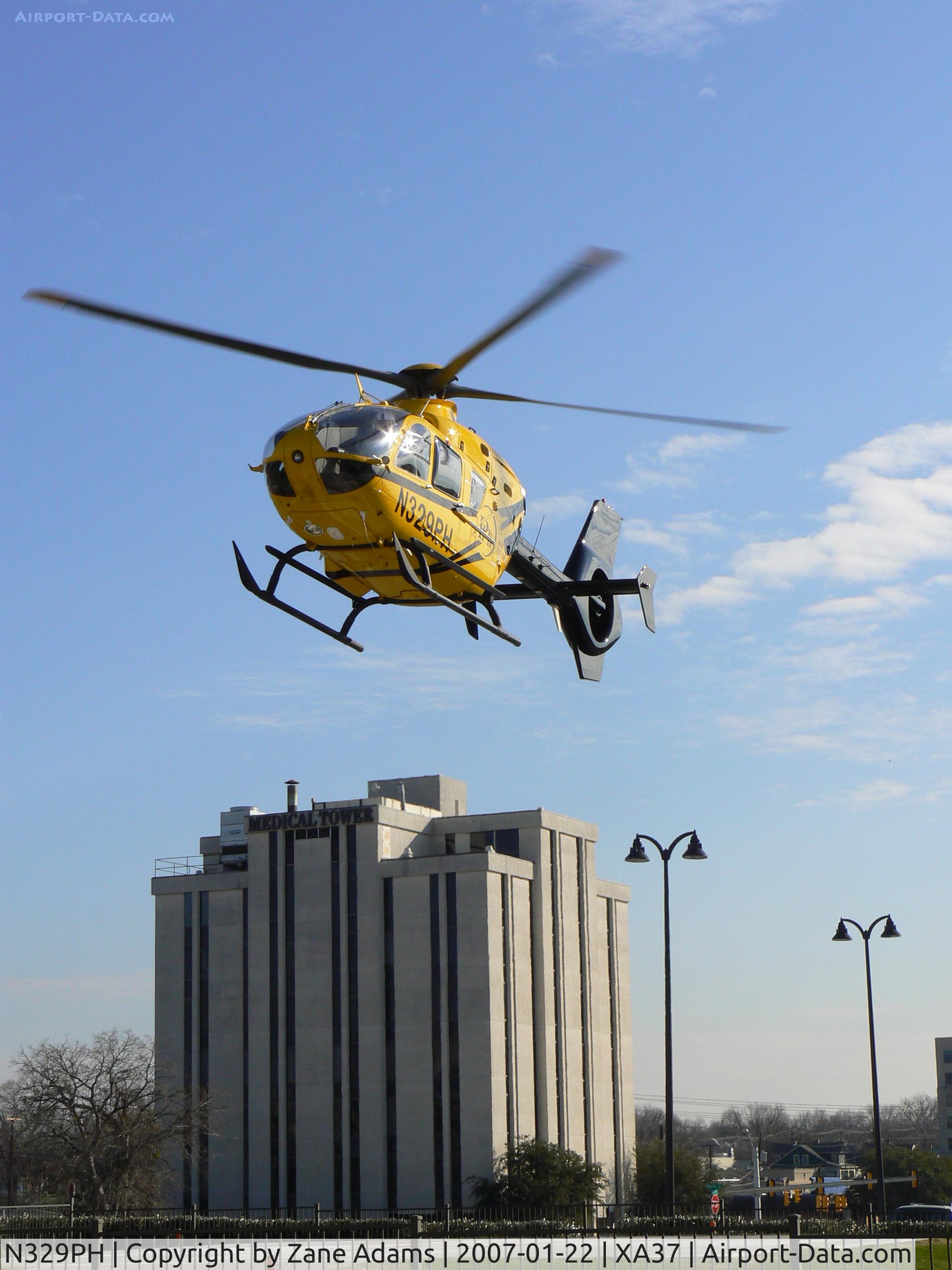 N329PH, 2006 Eurocopter EC-135P-2 C/N 0489, Leaving hospital pad in the medical district @ Ft. Worth, TX