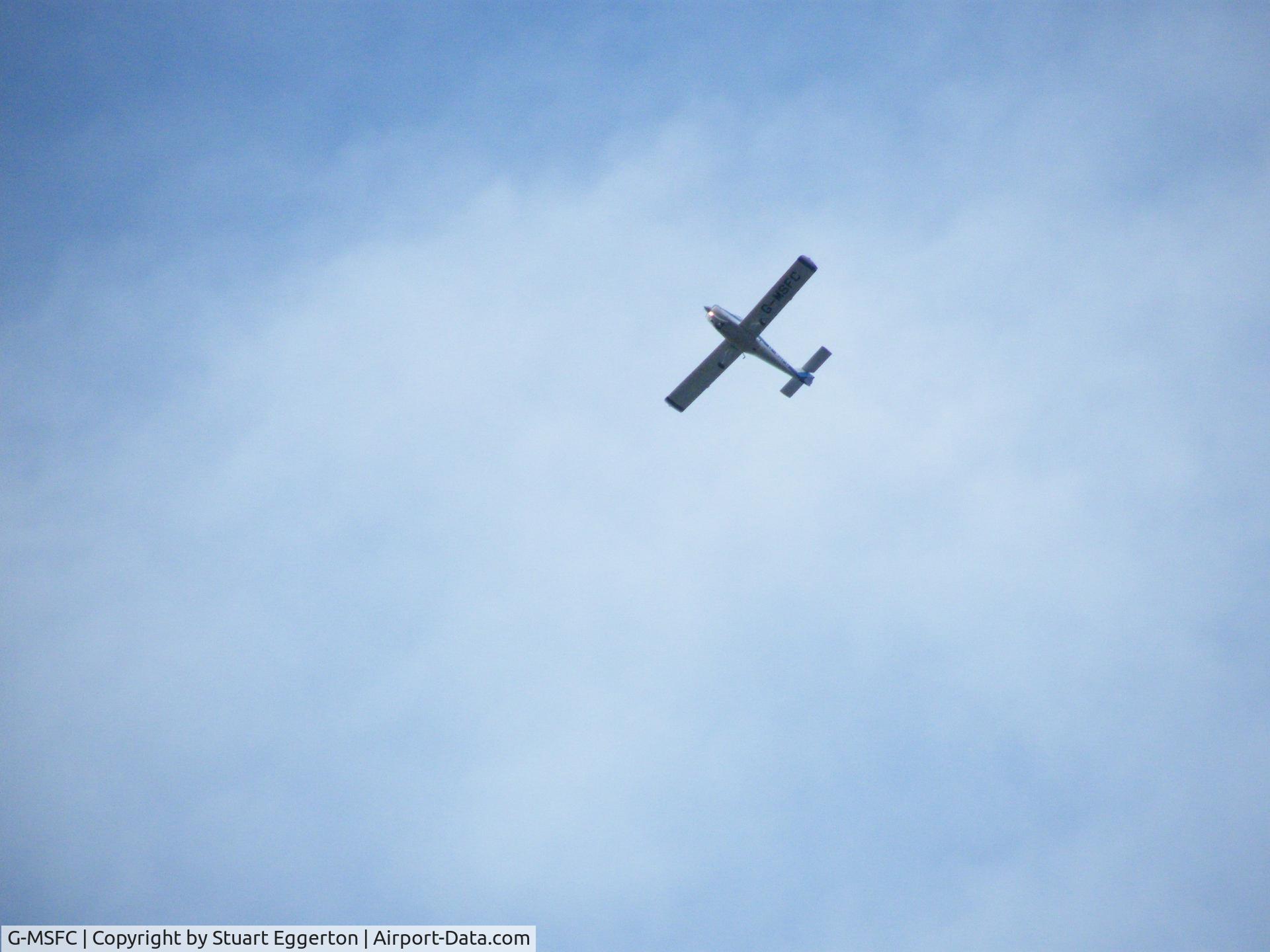 G-MSFC, 1981 Piper PA-38-112 Tomahawk Tomahawk C/N 38-81A0067, Taken of the plane passing over the village of Ollerton using 18x zoom