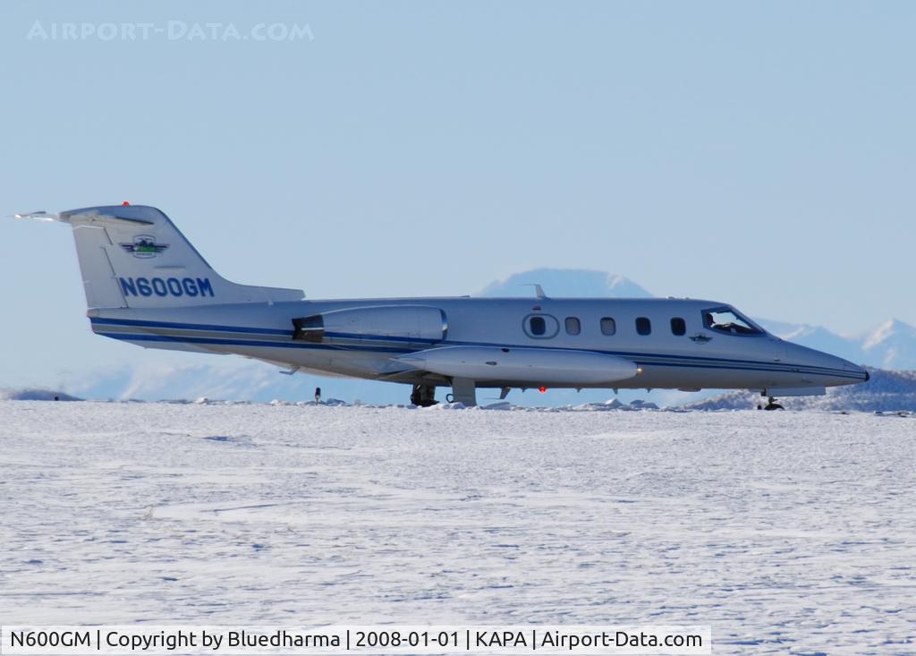 N600GM, 1981 Gates Learjet 25D C/N 290, Airlife Denver taxi to takeoff with Pikes Peak in the distance.