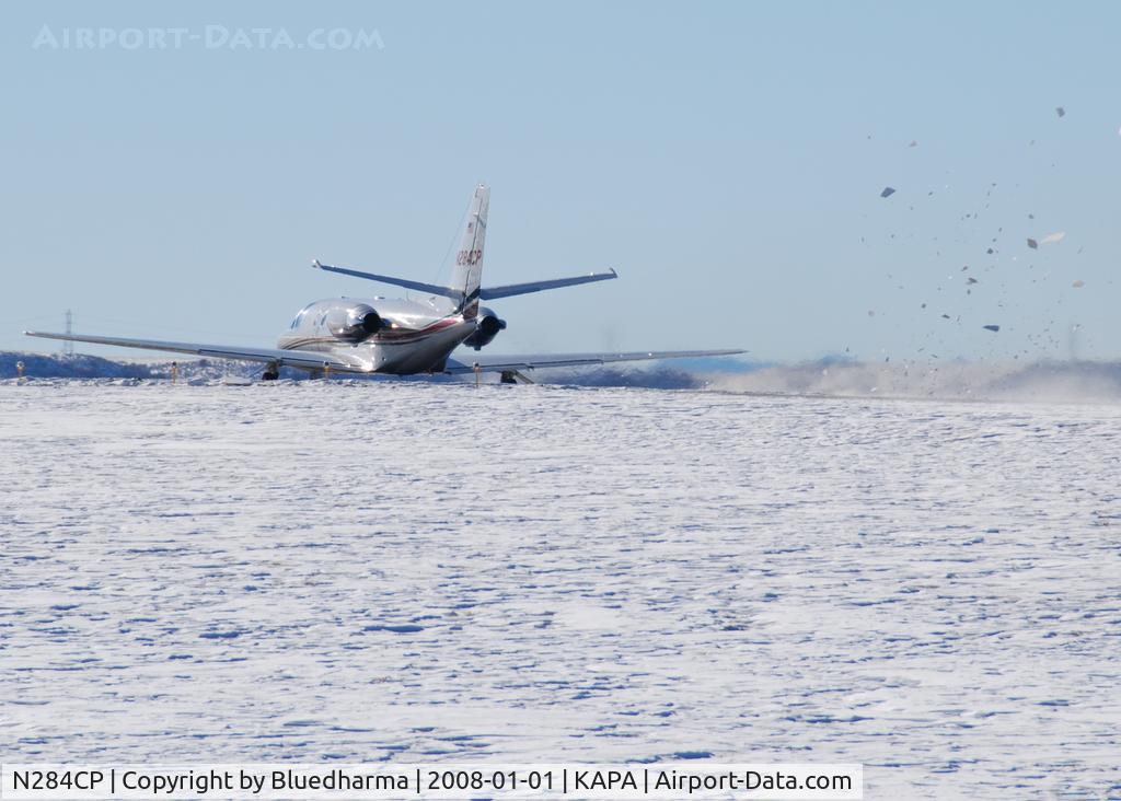 N284CP, 1996 Cessna 560 C/N 560-0358, Takeoff and full power. Look at the snow fly!