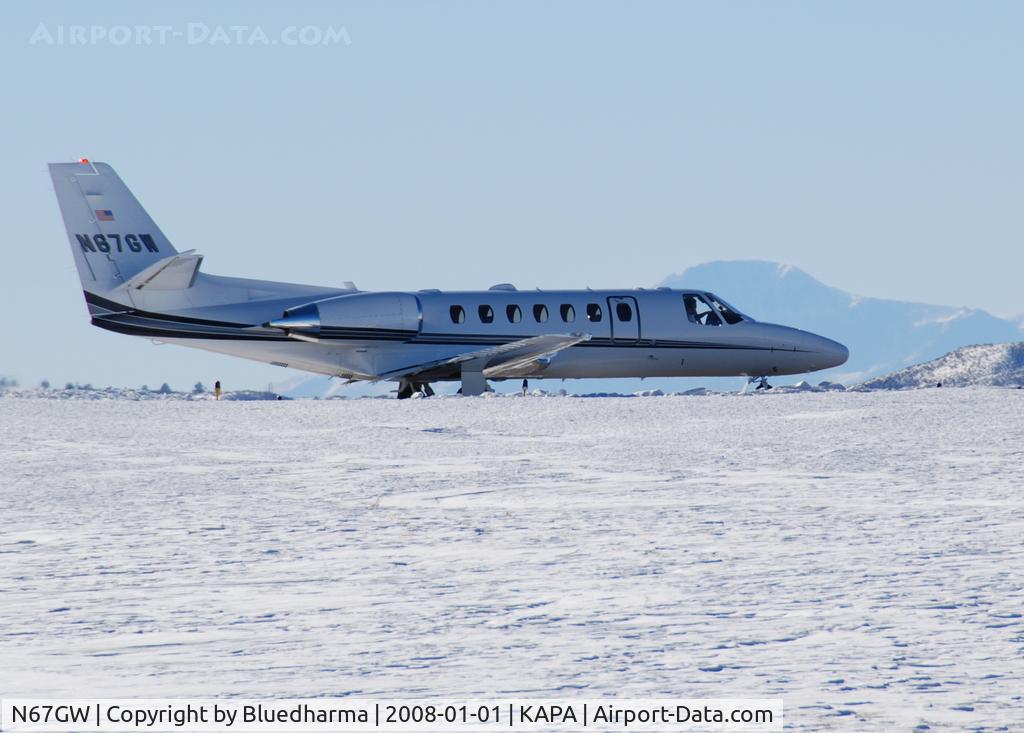 N67GW, 2003 Cessna 560 Citation Encore C/N 560-0641, Taxi to takeoff with Pikes Peak in the distance.