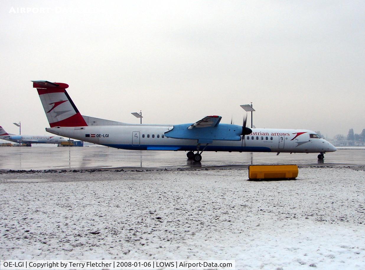 OE-LGI, 2004 De Havilland Canada DHC-8-402Q Dash 8 C/N 4100, Austrian Arrows Dash 8 leaves the main salzburg ramp