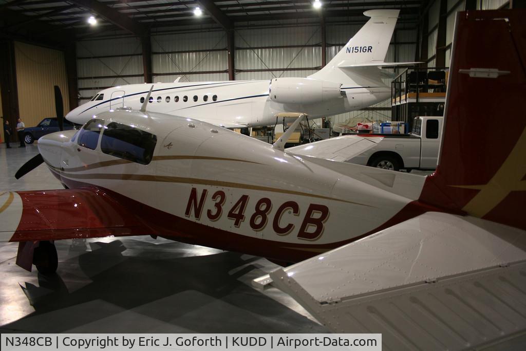 N348CB, 2007 Mooney M20TN Acclaim C/N 31-0033, Sitting in the hanger next to N151GR at KUDD