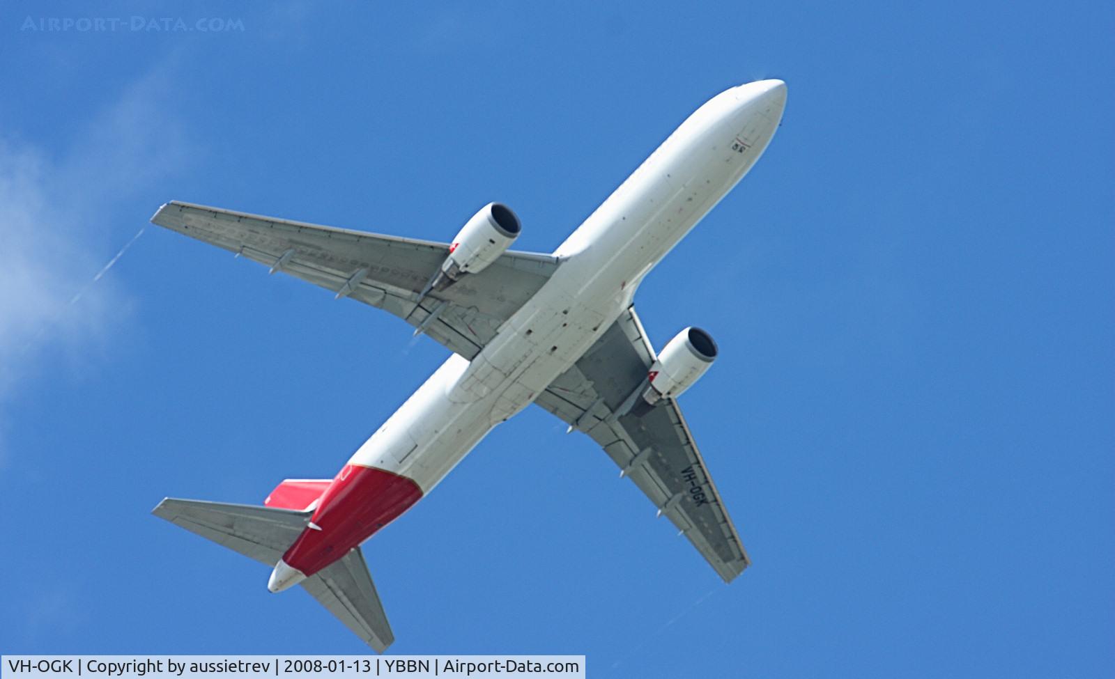 VH-OGK, 1991 Boeing 767-338 C/N 25316, Banking turn during climb out from Brisbane Airport, note the contrails forming from the wingtips