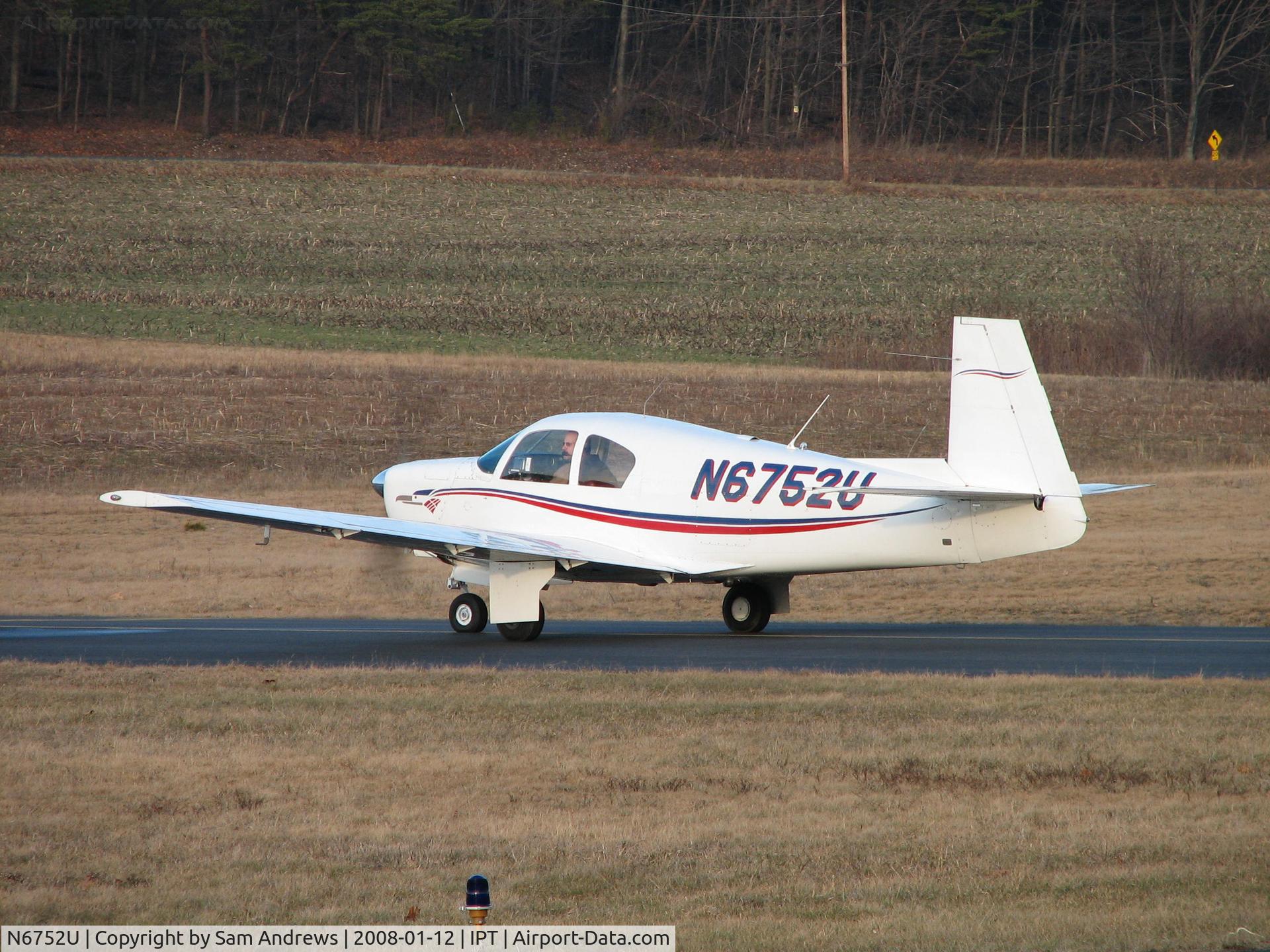 N6752U, 1963 Mooney M20C Ranger C/N 2474, Waiting for the guy that just landed to get clear of the runway.