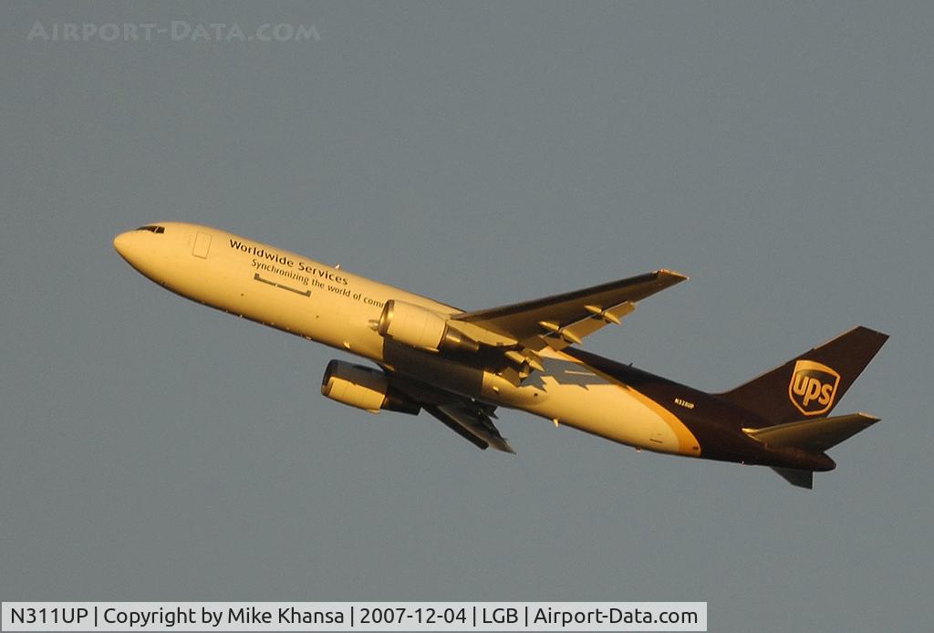 N311UP, 1996 Boeing 767-34AF C/N 27741, UPS B767-34AF with the warm rays of the setting sun.