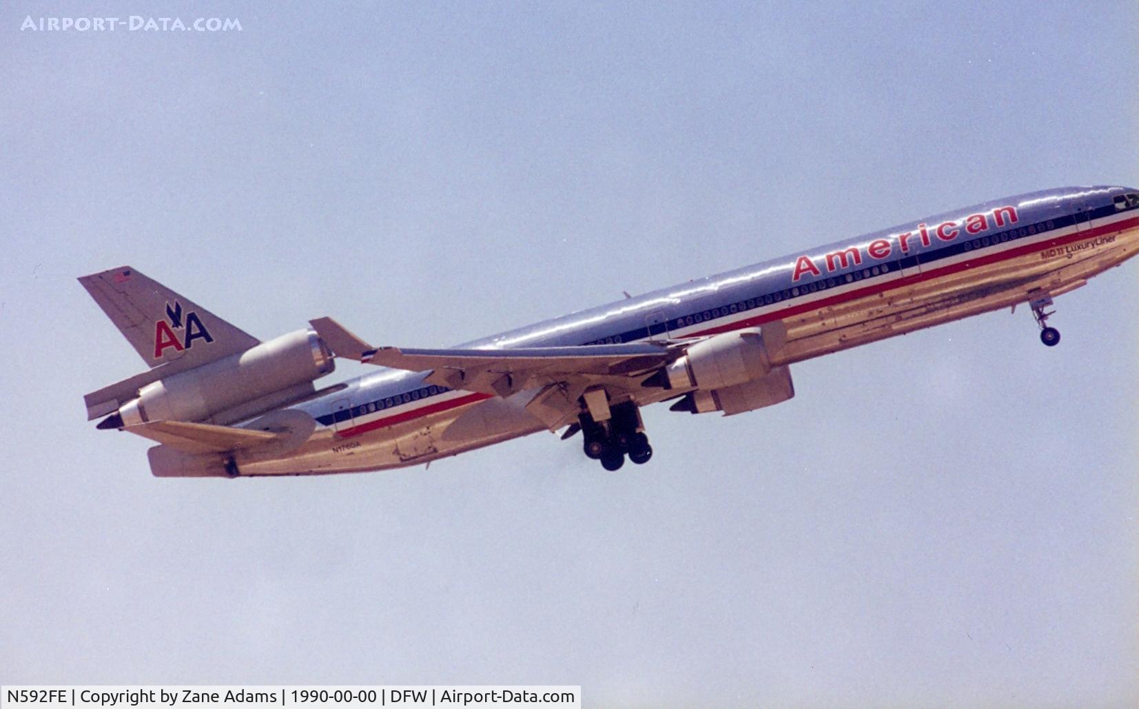 N592FE, 1992 McDonnell Douglas MD-11F C/N 48550, Formerly N1760A - Take off at DFW - Ahh the joys of shooting film...