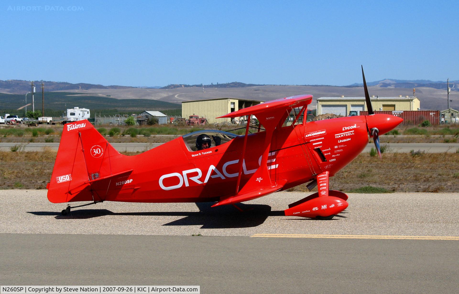 N260SP, 1981 Pitts S-2S Special C/N 1114C, Vibrantly-painted ORACLE/Tutima 1981 Oliver Steven R PITTS S-2S taxying (thumbs up! to me) @ Mesa Del Rey (King City) Municipal Airport, CA