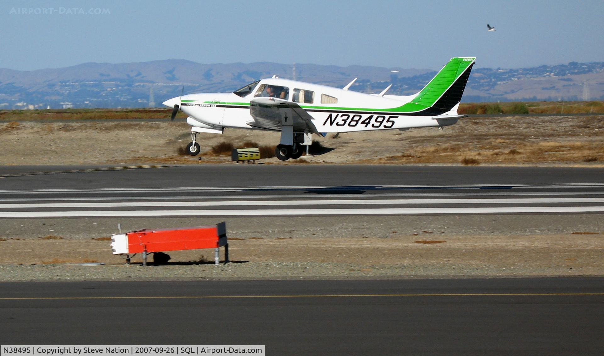 N38495, 1977 Piper PA-28R-201T Cherokee Arrow III C/N 28R-7703229, 1977 Piper PA-28R-201T landing @ San Carlos Airport, CA
