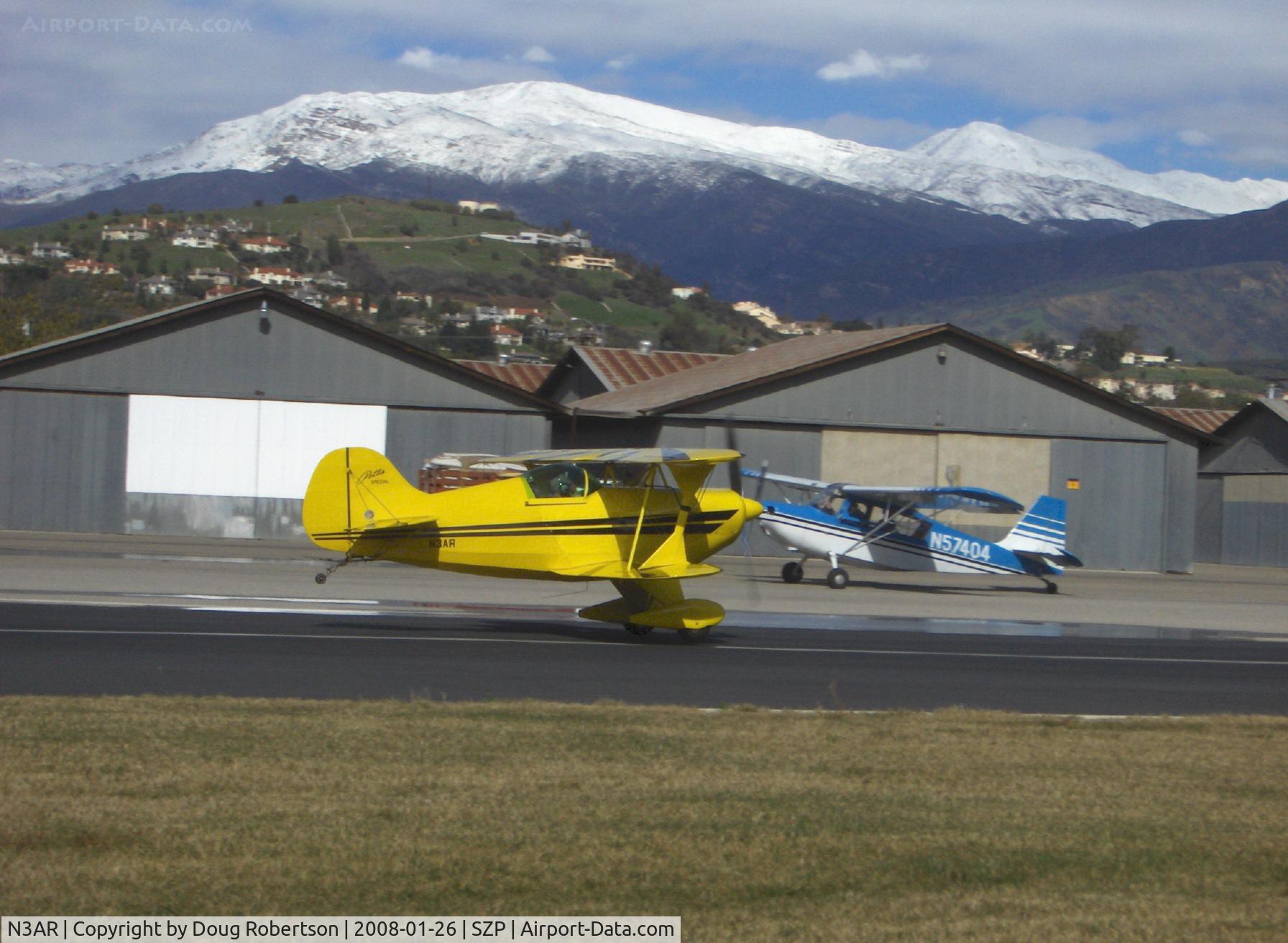 N3AR, 1974 Pitts S-1S Special C/N 10, 1974 Russell PITTS SPECIAL S-1S, fully aerobatic, Lycoming O&VO-360 180 Hp, takeoff roll Rwy 04. That's snow above 5,000 feet. Hines Peak in distance at right is 6,704'.