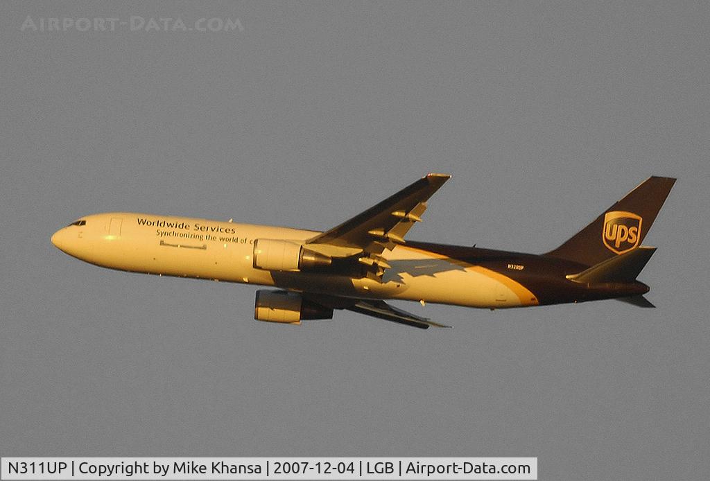 N311UP, 1996 Boeing 767-34AF C/N 27741, UPS B767-34AF lit by the warm rays of the setting sun.