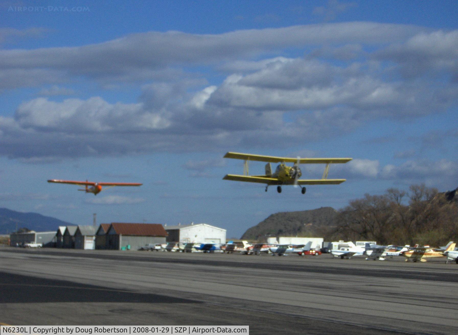 N6230L, 1964 Schweizer SGU 2-22E C/N 182, 1964 Schweizer SGU 2-22E Glider being towed aloft Rwy 22 by Dad in N7867 AG-CAT. Son in front, Glider CFI in back seat-checkout ride and exam for glider solo endorsement
