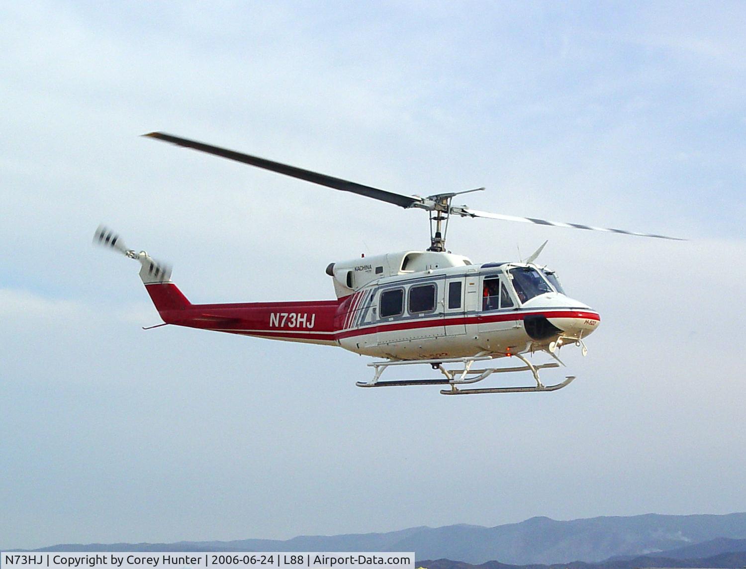 N73HJ, 1972 Bell 212 C/N 30552, This Helitack Bell 212, on loan from Idaho, ferries Hot Shot crews and supplies from a small airstrip thats been converted into a helibase for this large incident fire. You can see the smoldering hills in the background.