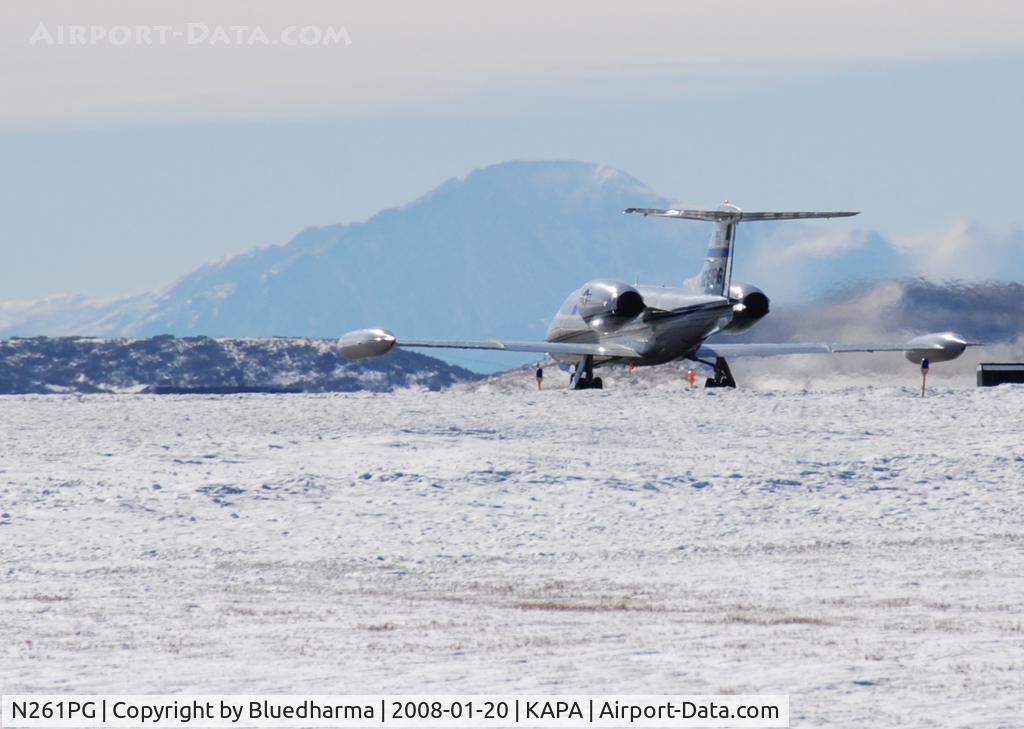 N261PG, 1980 Gates Learjet 35A C/N 329, Takeoff on 17L with Pikes Peak in the background.
