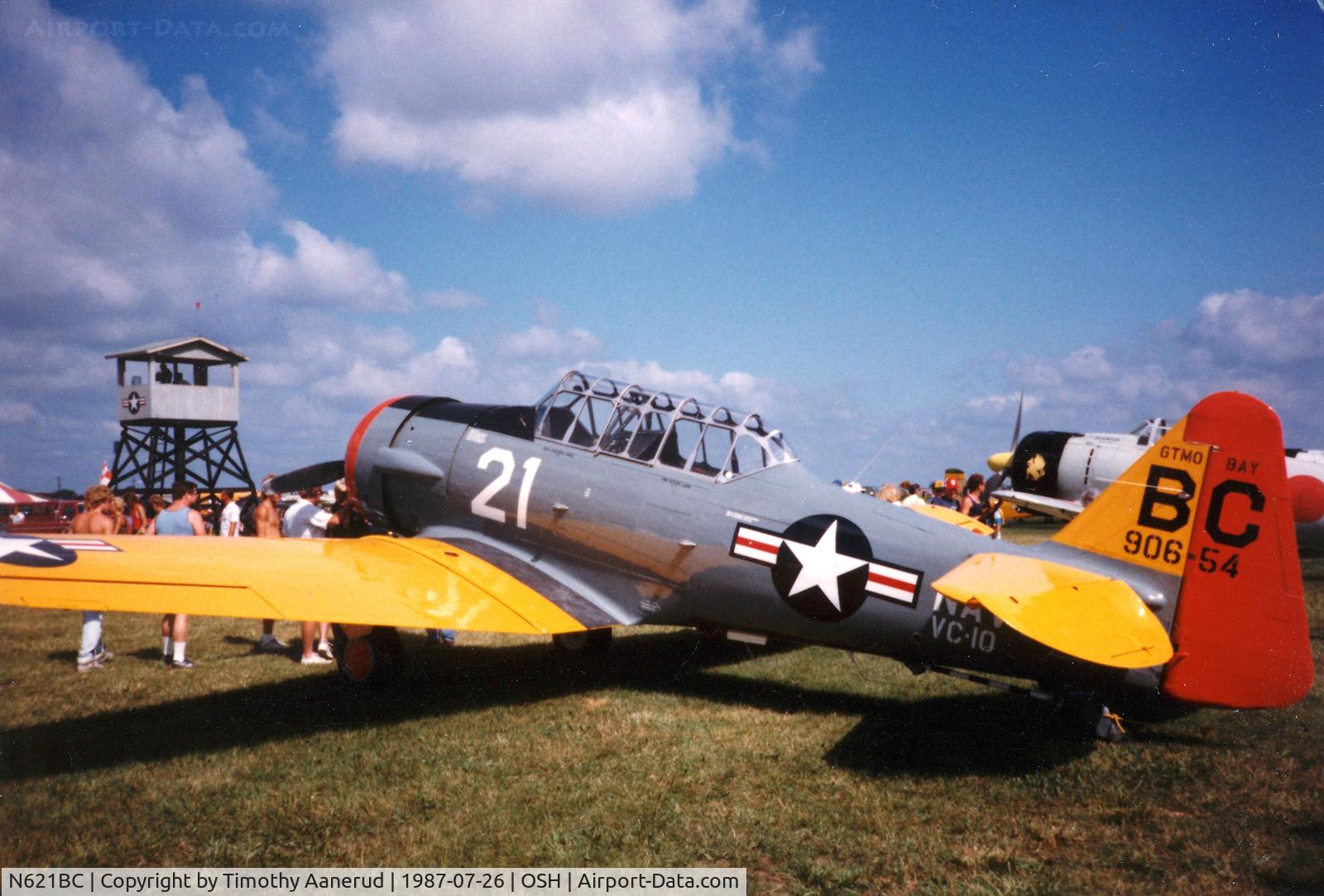 N621BC, 1944 North American SNJ-5C Texan Texan C/N 88-17652, Oshkosh 1987, serial 42-85878, BuNo 906661.  90654 marking is not the BuNo as it is on some other SNJ's in this paint scheme.