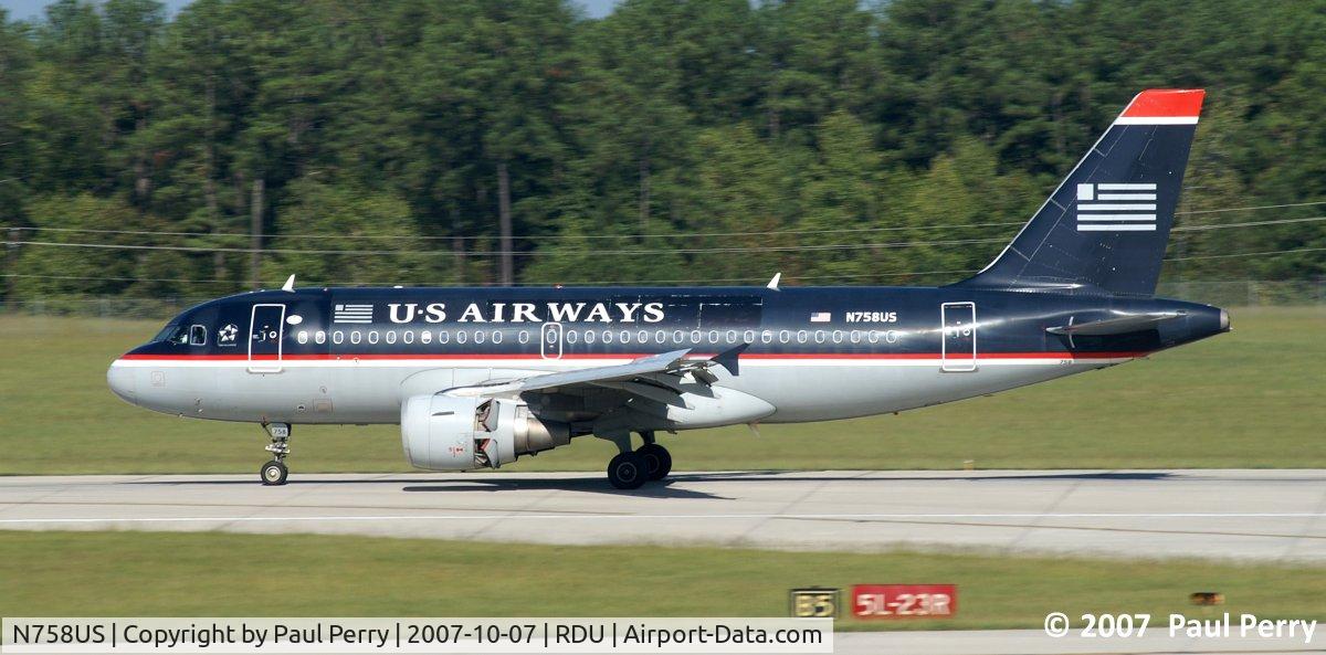 N758US, 2000 Airbus A319-112 C/N 1348, Firmly on the ground, and the engine's diverters wide open