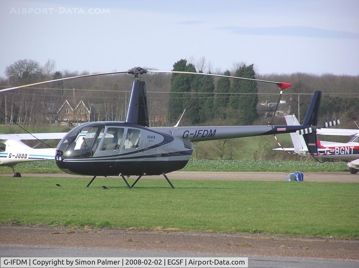 G-IFDM, 1999 Robinson R44 Astro C/N 0707, Robinson R44 Astro parked at Conington