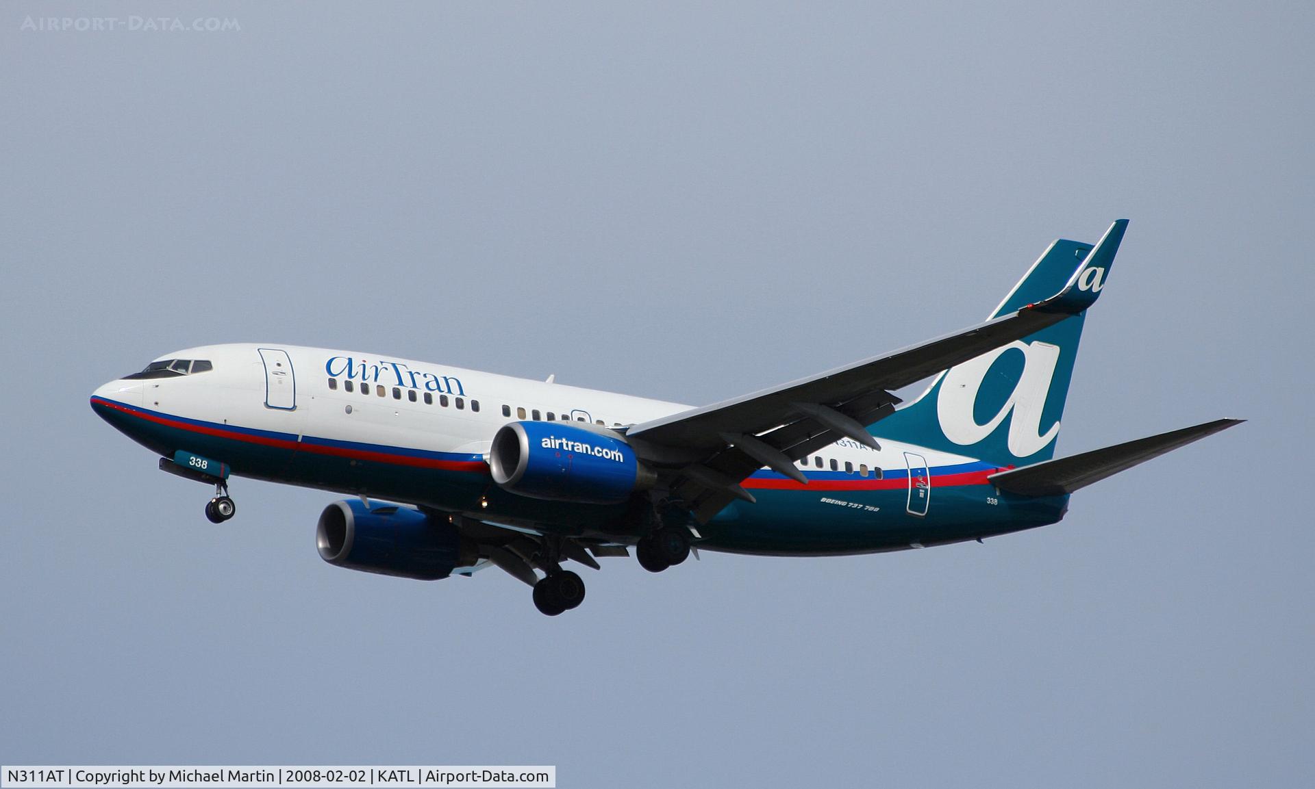 N311AT, 2006 Boeing 737-7BD C/N 33930, On final for Runway 26R