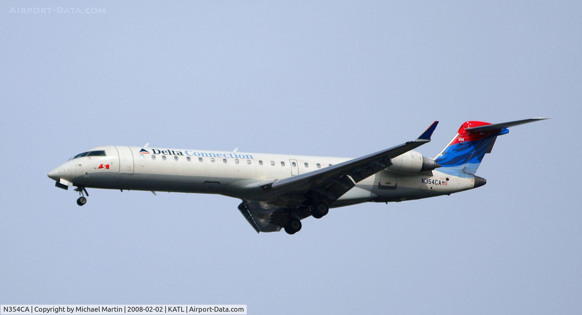 N354CA, 2002 Bombardier CRJ-701ER (CL-600-2C10) Regional Jet C/N 10064, On final for Runway 26R