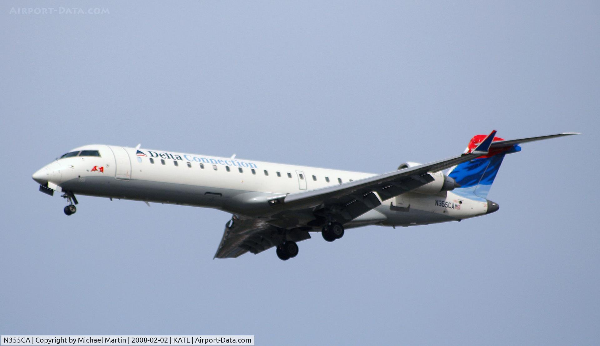N355CA, 2002 Bombardier CRJ-701ER (CL-600-2C10) Regional Jet C/N 10067, On final for Runway 26R