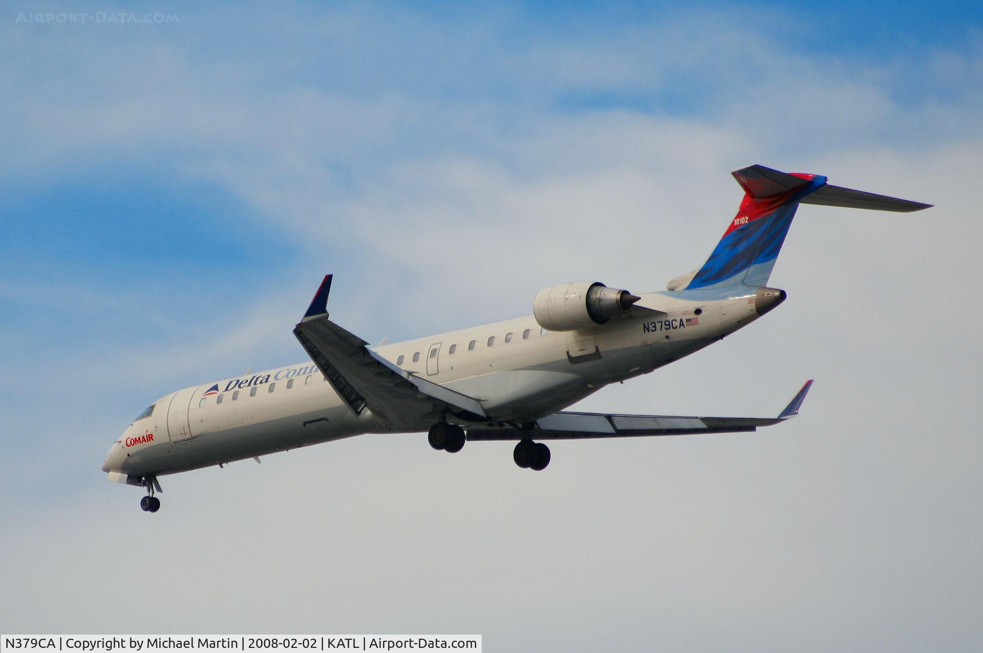 N379CA, 2003 Bombardier CRJ-701ER (CL-600-2C10) Regional Jet C/N 10102, Over the numbers of 26R