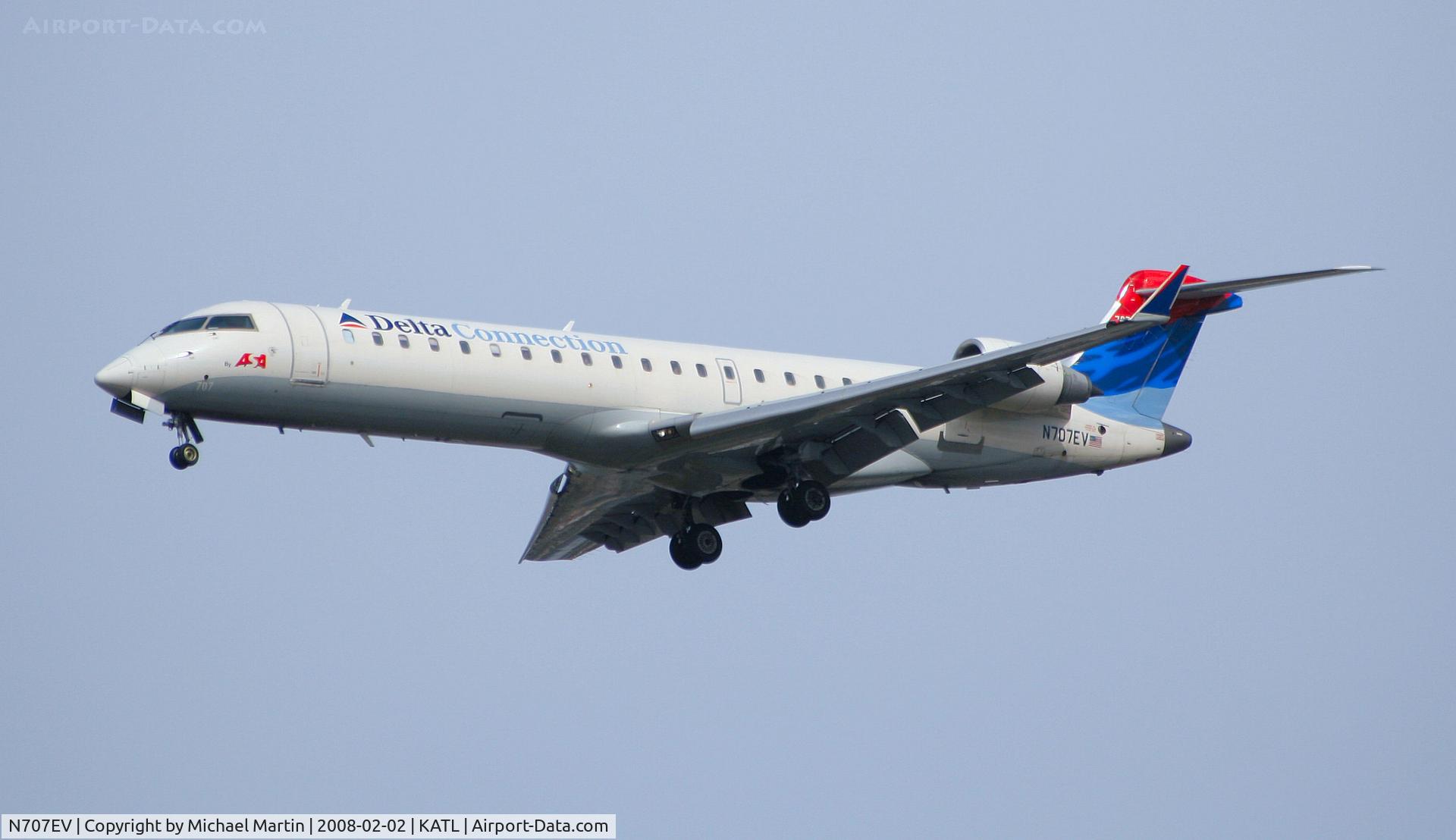 N707EV, 2002 Bombardier CRJ-701 (CL-600-2C10) Regional Jet C/N 10057, On final for Runway 26R