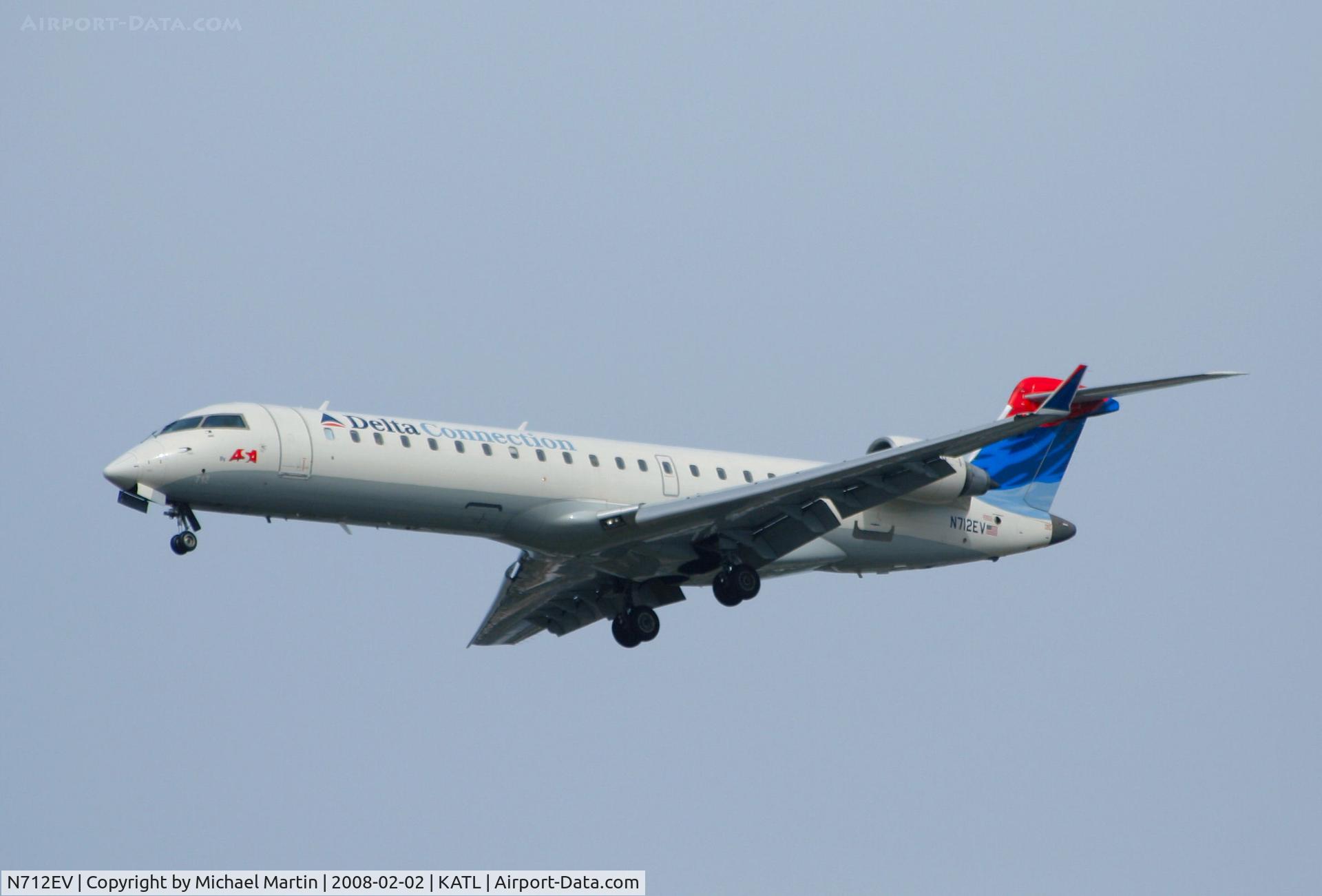 N712EV, 2002 Bombardier CRJ-701ER (CL-600-2C10) Regional Jet C/N 10074, On final for Runway 26R