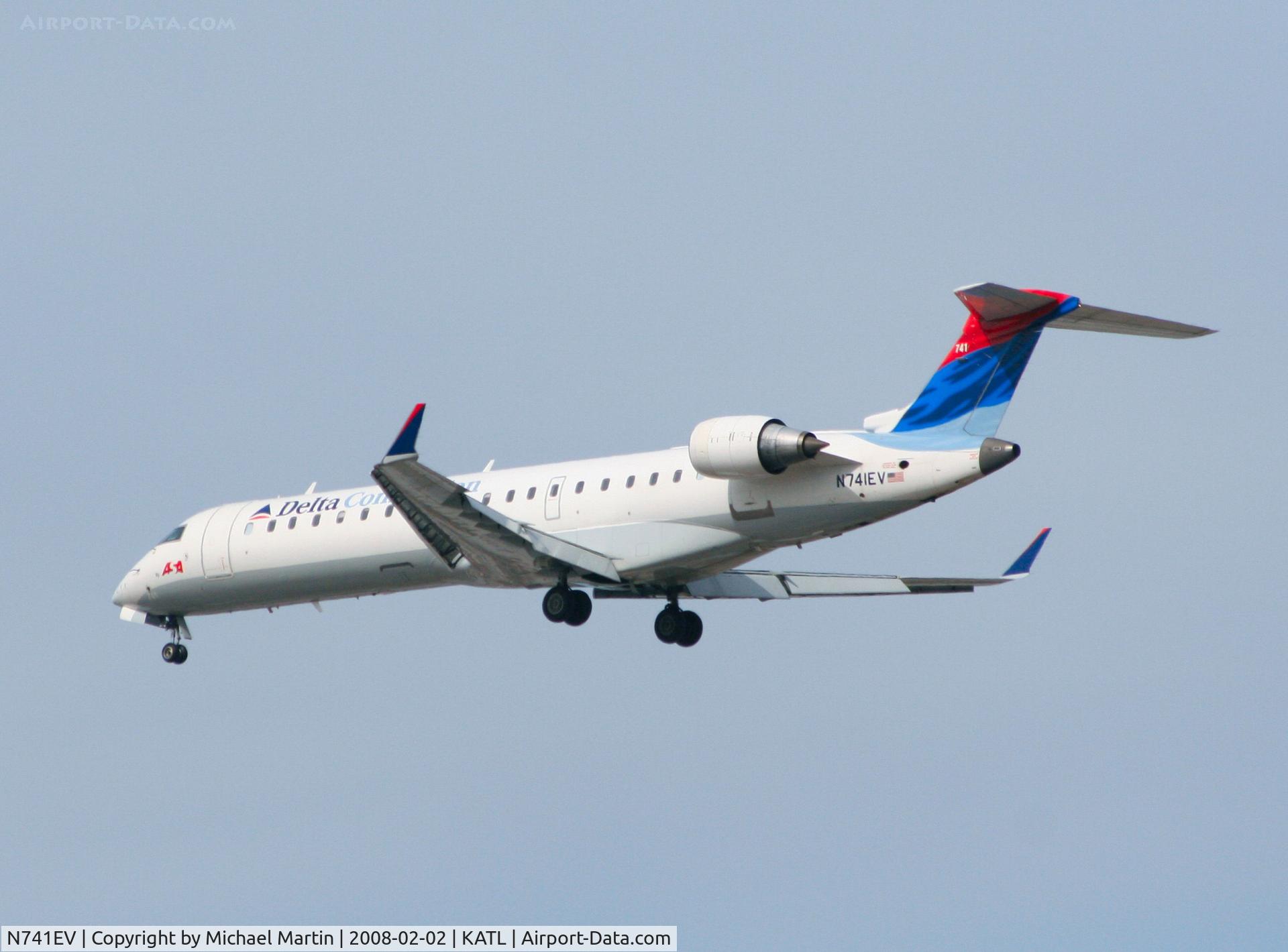 N741EV, 2004 Bombardier CRJ-701ER (CL-600-2C10) Regional Jet C/N 10155, Over the numbers of 26R