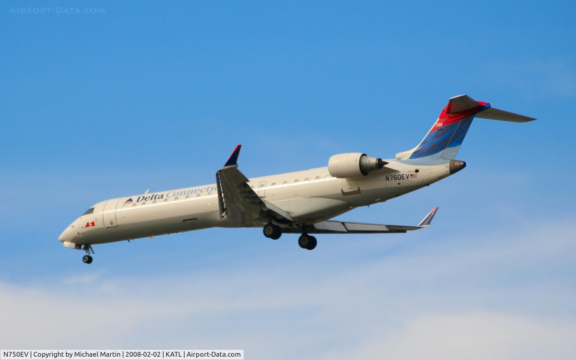 N750EV, 2004 Bombardier CRJ-701 (CL-600-2C10) Regional Jet C/N 10161, Over the numbers of 26R