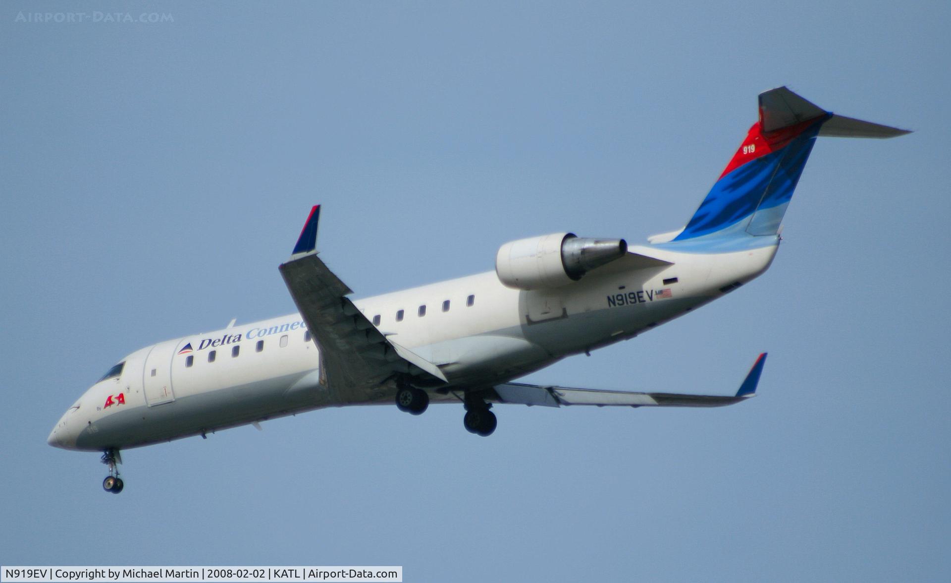 N919EV, 2003 Bombardier CRJ-200ER (CL-600-2B19) C/N 7780, Over the numbers of 26R