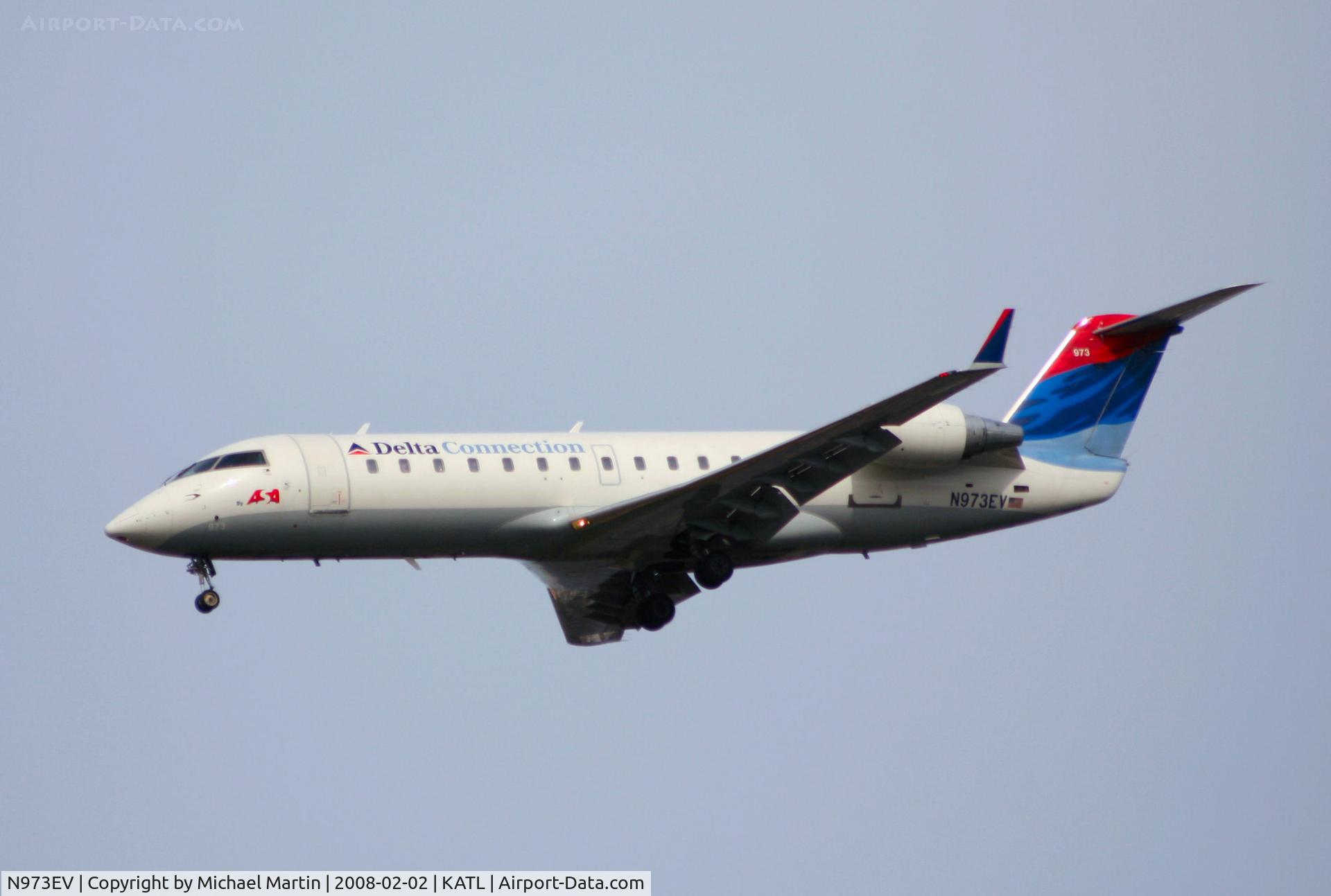 N973EV, 2002 Bombardier CRJ-200ER (CL-600-2B19) C/N 7575, On final for Runway 26R