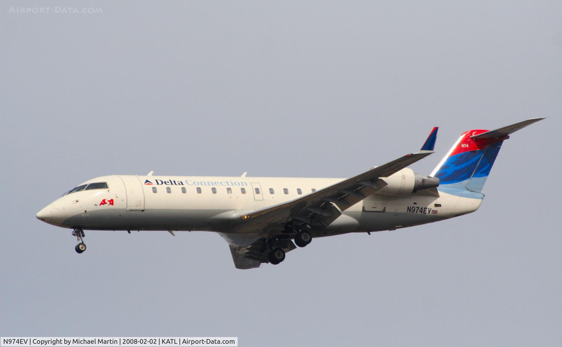N974EV, 2001 Bombardier CRJ-200ER (CL-600-2B19) C/N 7594, On final for Runway 26R