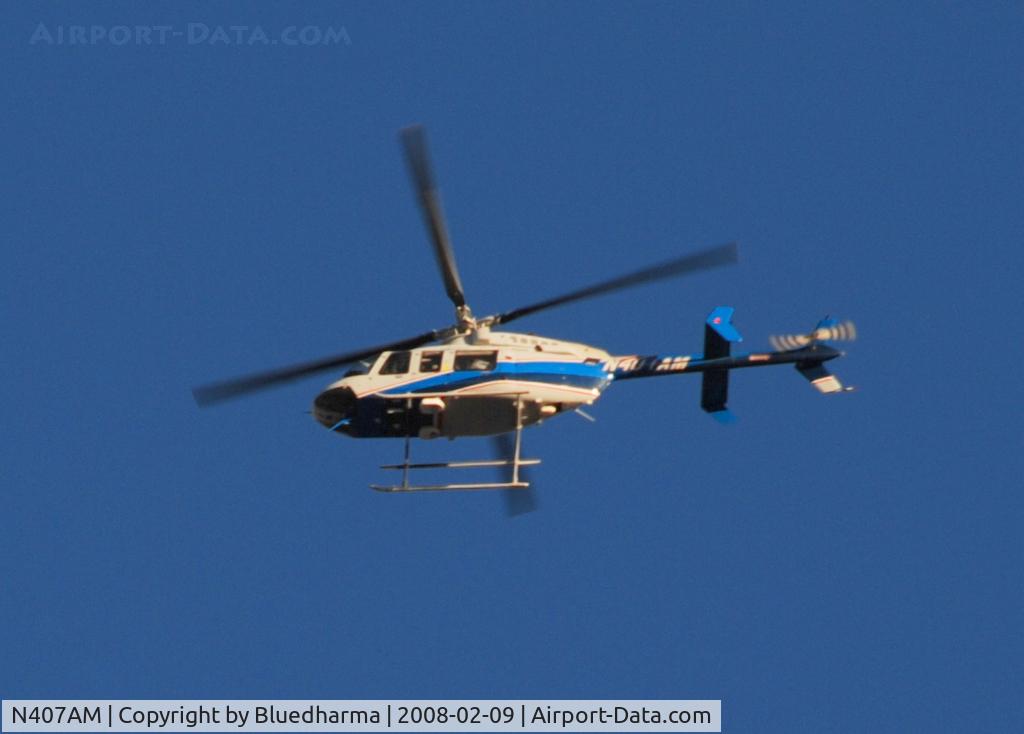 N407AM, 1998 Bell 407 C/N 53309, Flyover of Columbine High School.