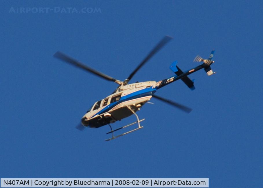 N407AM, 1998 Bell 407 C/N 53309, Flyover of Columbine High School.