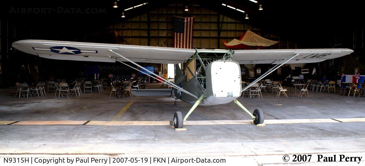 N9315H, 1949 Stinson L-5 Sentinel C/N 4215060, Standing proud at the hangar doors