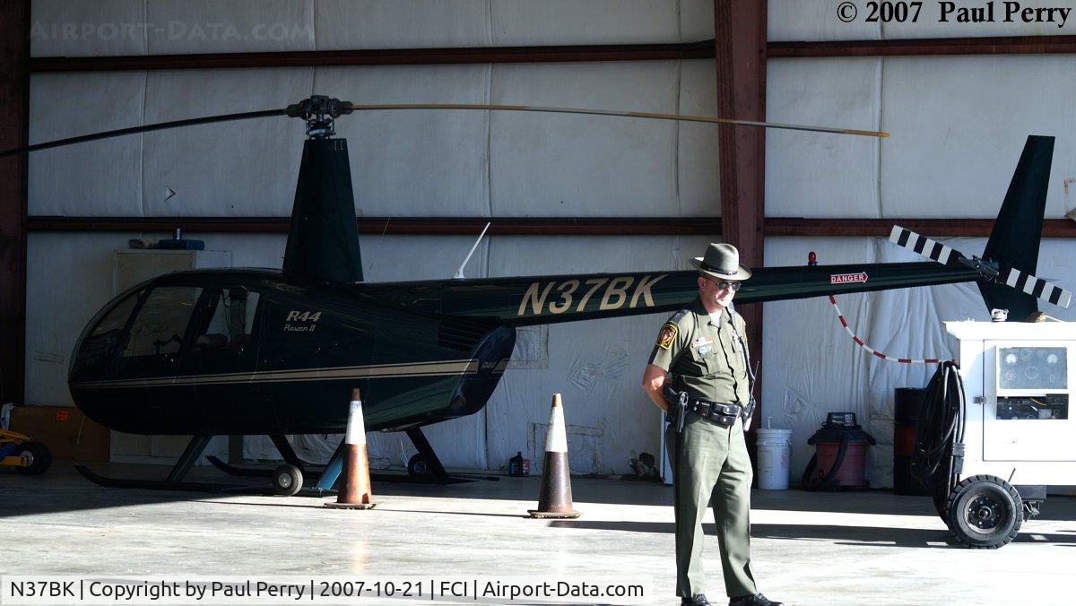 N37BK, 2004 Robinson R44 II C/N 10542, Under guard?  Wonder what she did?